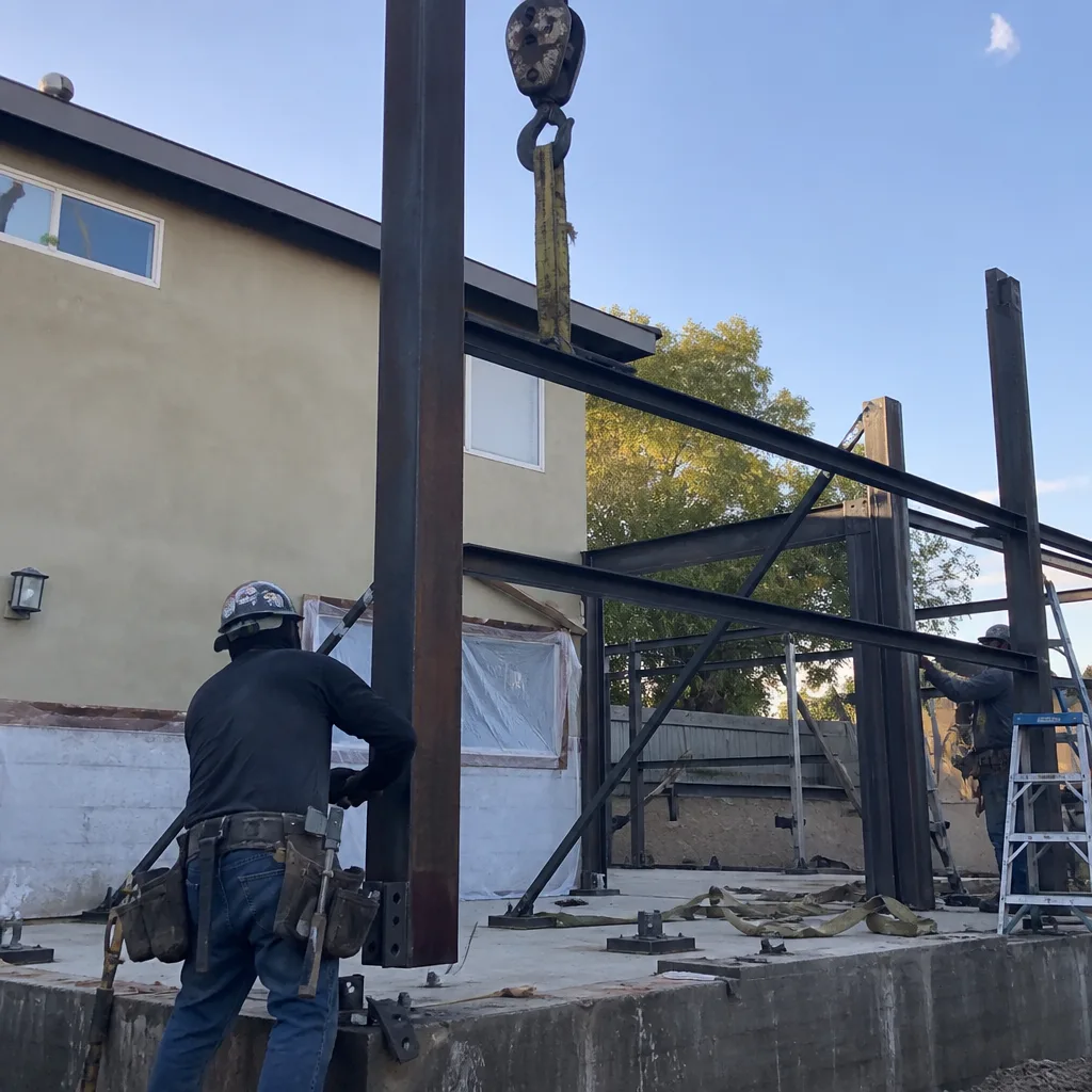 construction workers assembling a steel frame for a new detached ADU